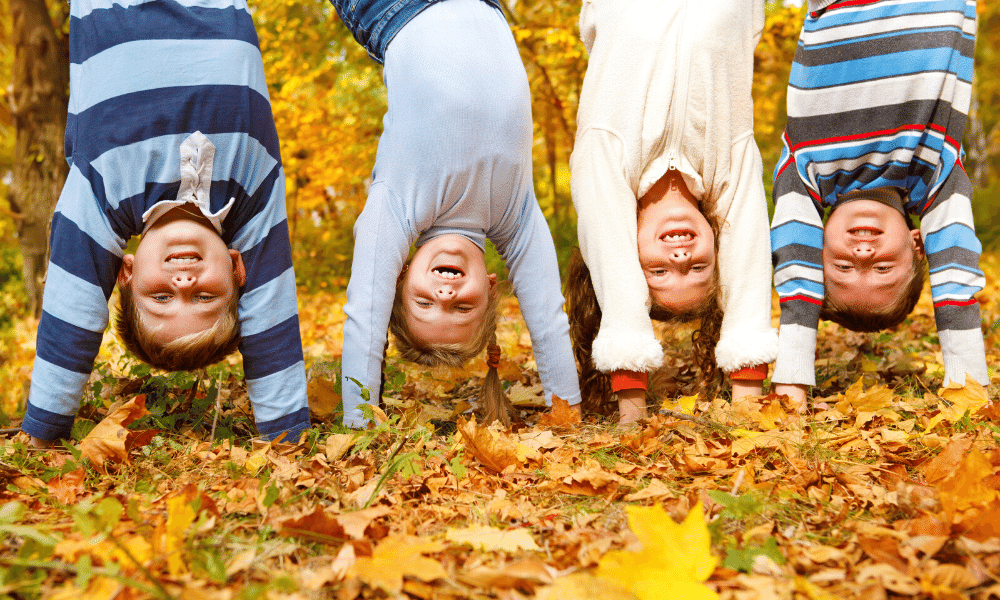 children standing on their heads ready to drink water